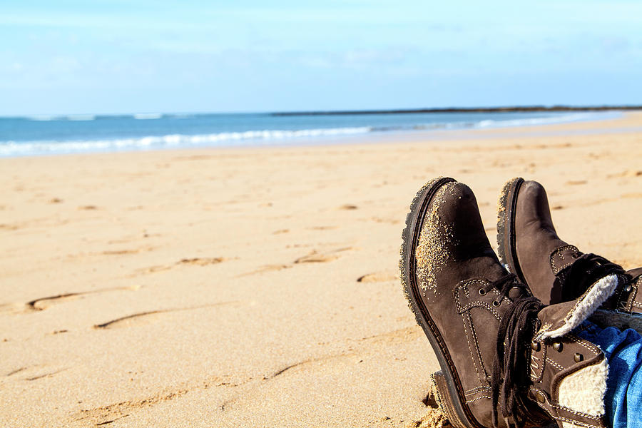 Feet In Brown Boots At A Beach Photograph by Gina Koch