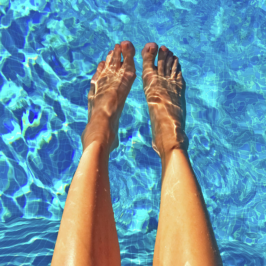 Summer Photograph - Female feet in blue water by GoodMood Art