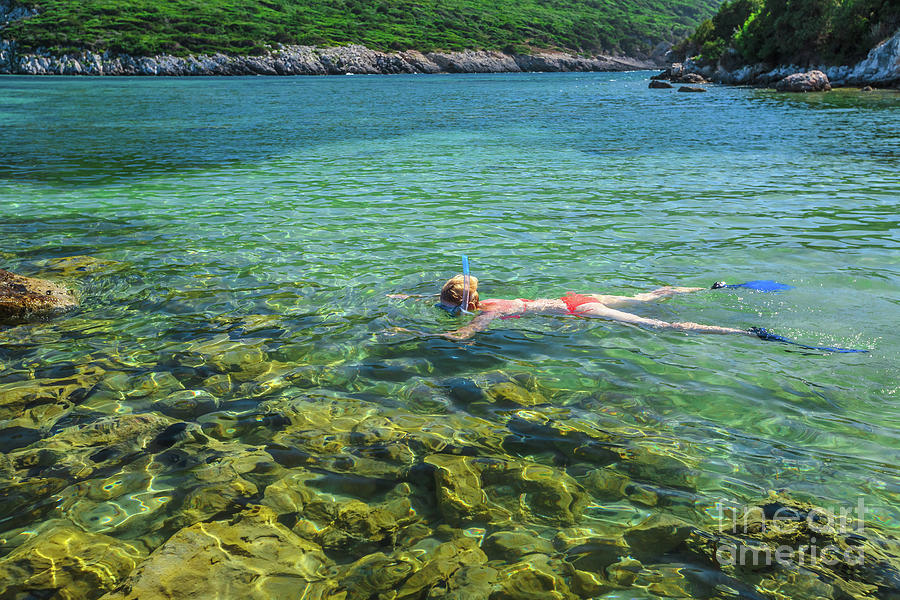 Female snorkeler in tropical sea Photograph by Benny Marty