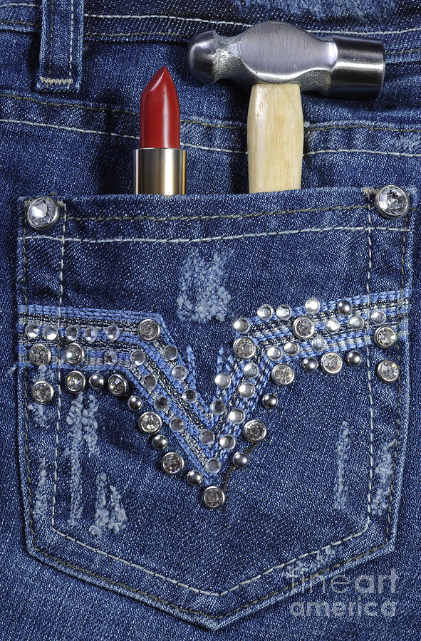 Female worker blue jeans with rhinestone decoration  Photograph by Milleflore Images