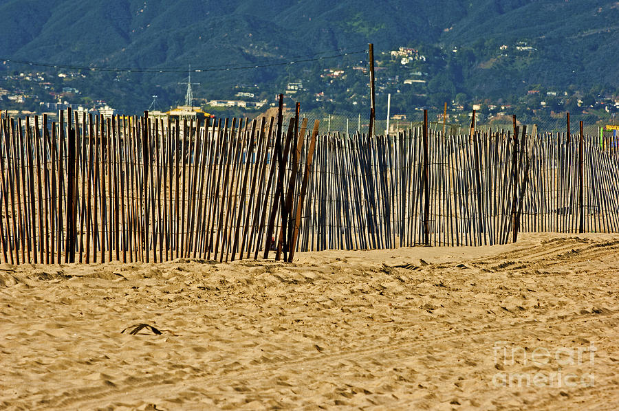Fence on Santa Monica beach Photograph by Micah May