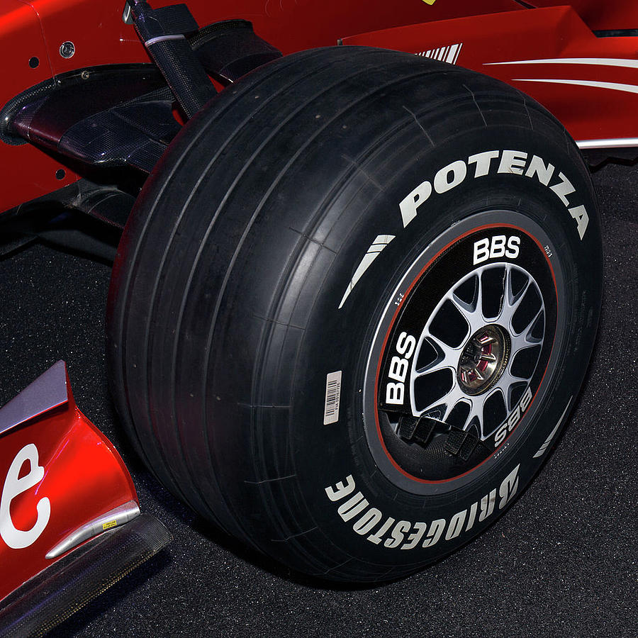 Ferrari F2007 tire and wheel cover Photograph by Paul Fearn
