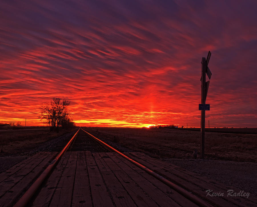 Sunset Photograph - Fiery sunset with Sun Pillar by Kevin Radley