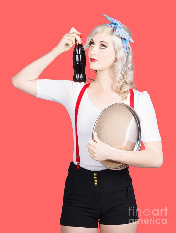 Fifties diner pin-up waiter serving soft drink  Photograph by Jorgo Photography