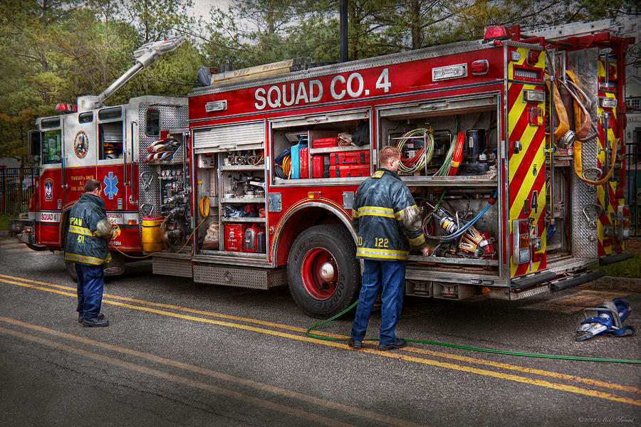 Firemen - The modern fire truck Photograph by Mike Savad
