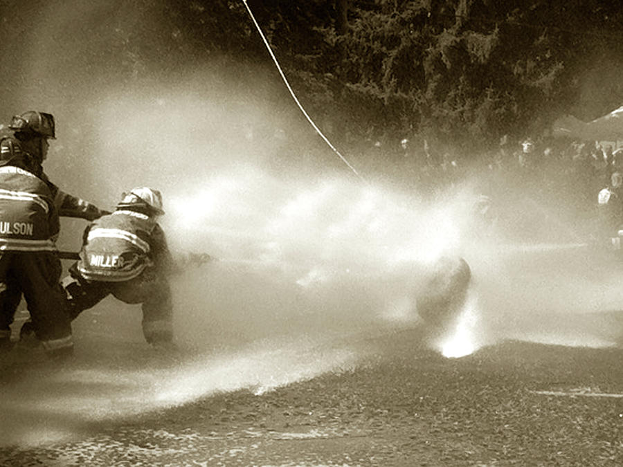Firemens Water Fight Photograph by Alison Stein