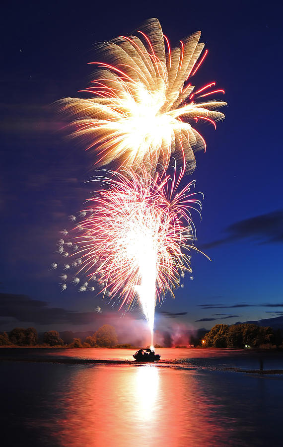 Fireworks Launching From Boat Photograph by Evan Sharboneau