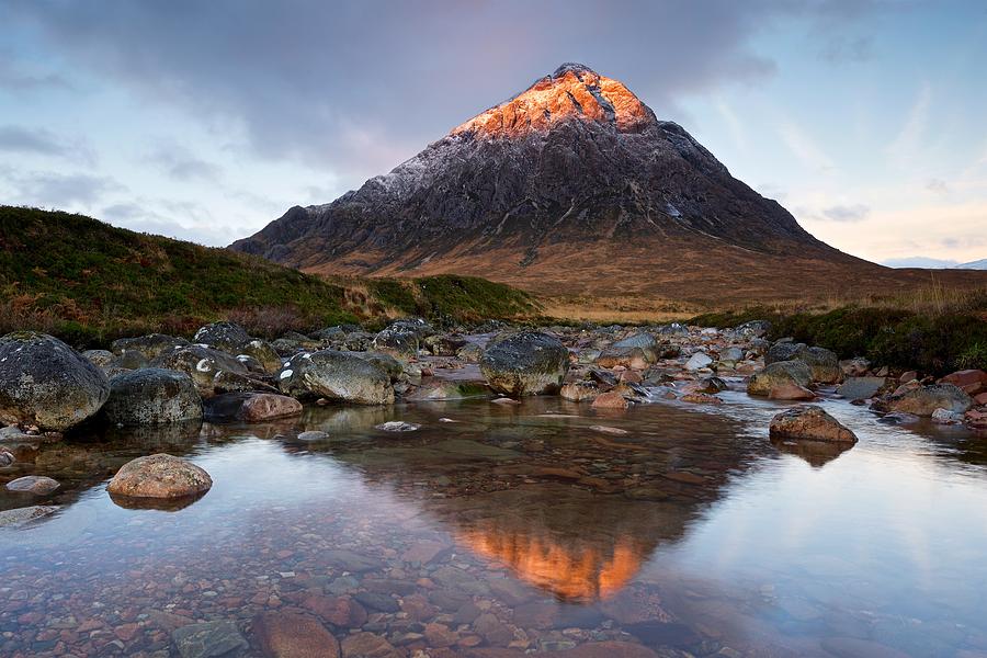 First light hits the peak of Stob Dearg Photograph by Stephen Taylor