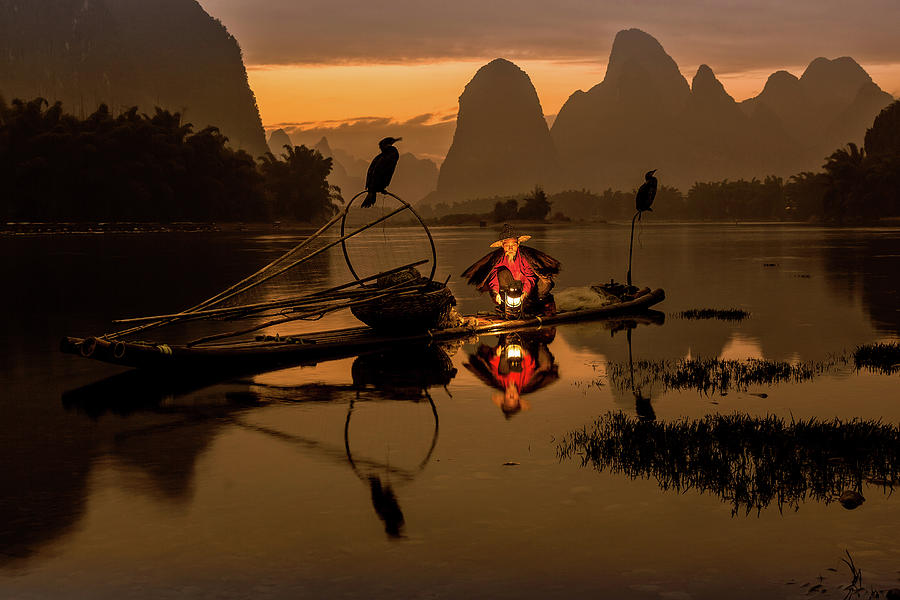 Fisherman in Xing Ping, China Photograph by Jose Luis Vilchez