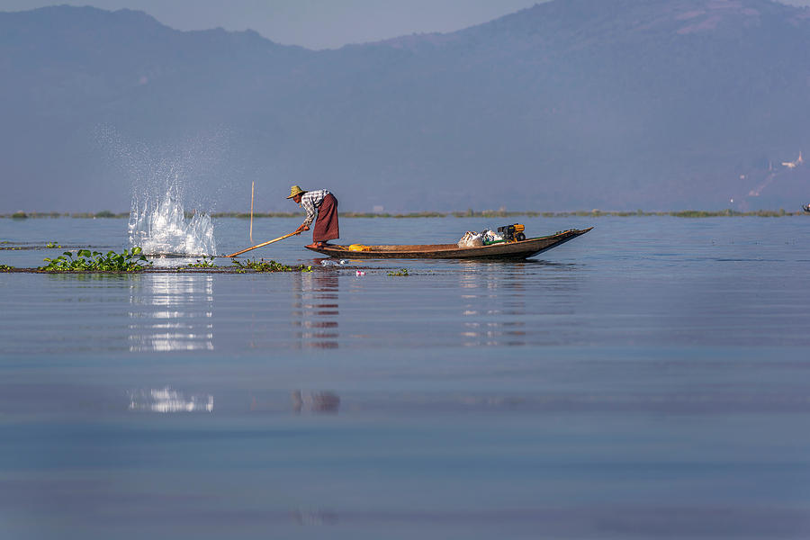 Fisherman on his boat catching fish Photograph by Pradeep Raja PRINTS