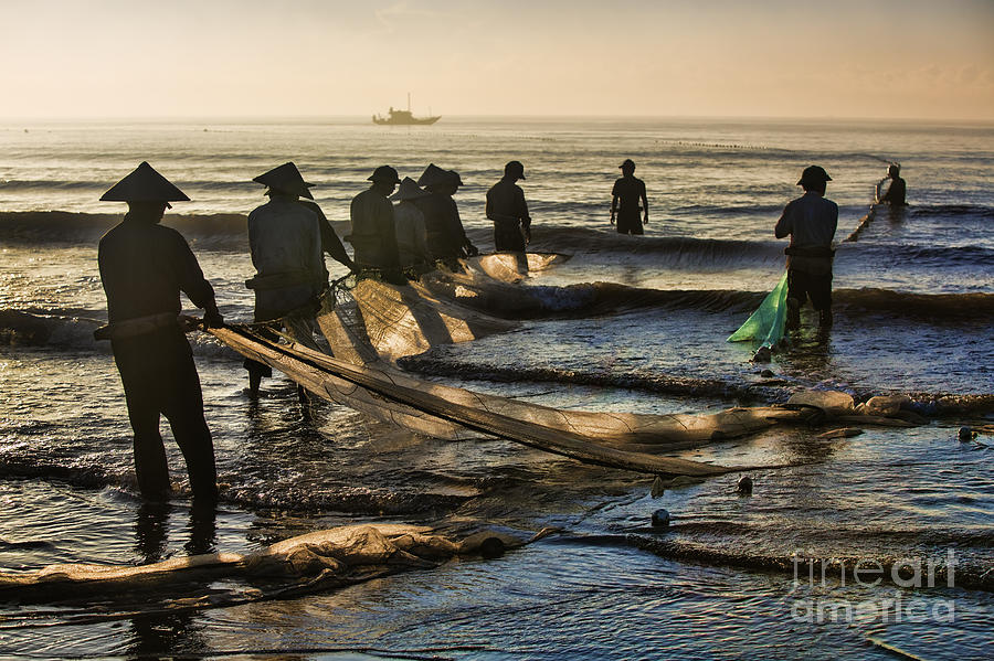 Fishermen End of Day Vietnam Photograph by Chuck Kuhn