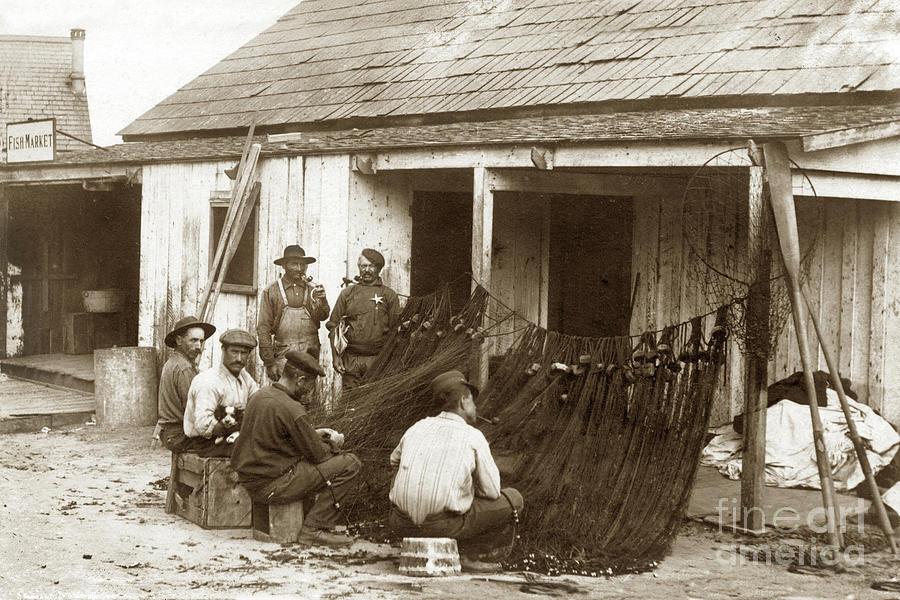 Fishermen Photograph - Fishermen repairing nets Santa Cruz Circa 1907 by Monterey County Historical Society