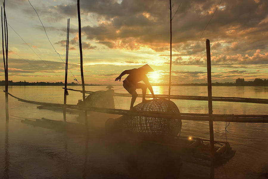 Fishermen using fishing nets.Silhouette fisherman on boat ,fishi