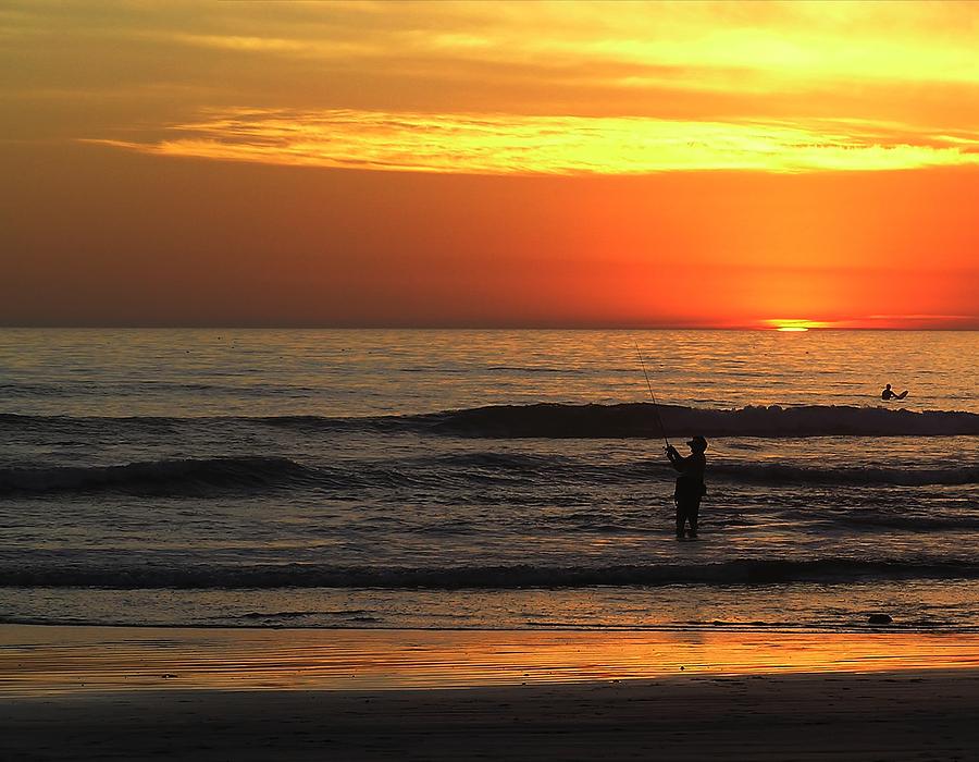 Fishing at Sunset Photograph by Chuck Cannova