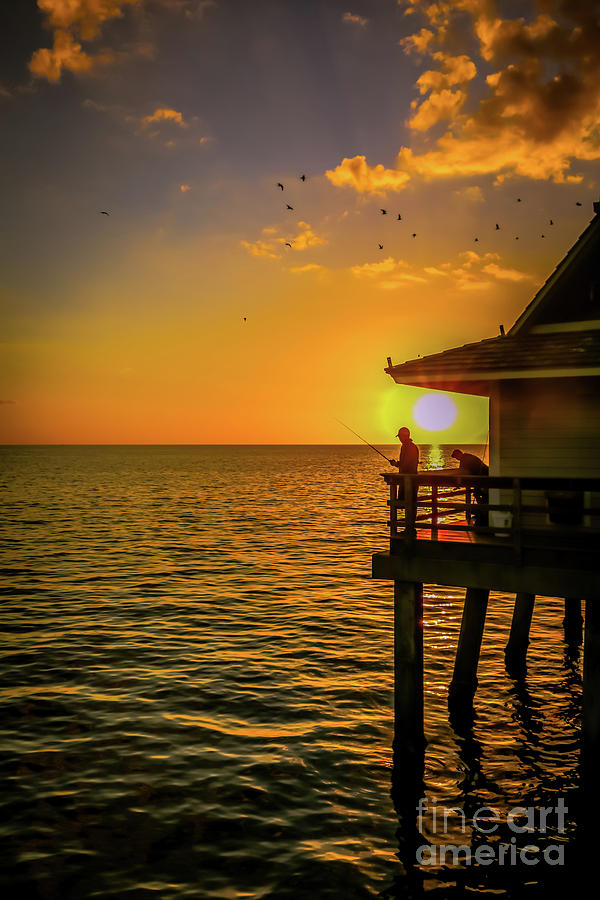 Fishing at sunset on Naples Pier Photograph by Claudia M Photography