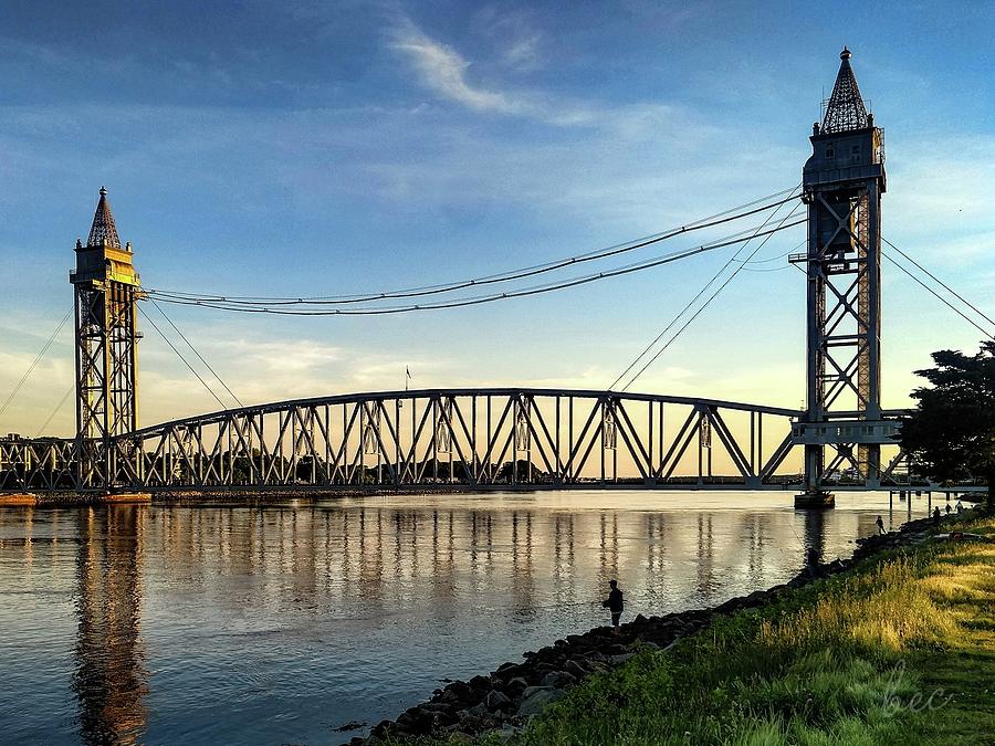 Fishing at the Cape Cod canal by the train bridge at twilight Photograph by Bruce Carpenter