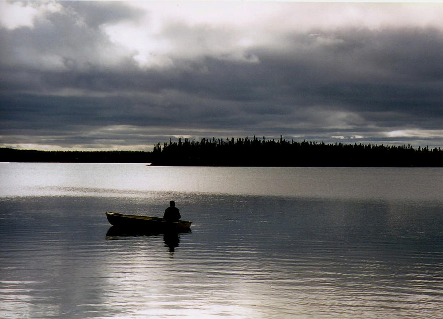 Fishing before the storm Photograph by David Matthews