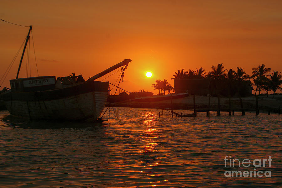 Fishing boat at sunset. Photograph by Gilad Flesch