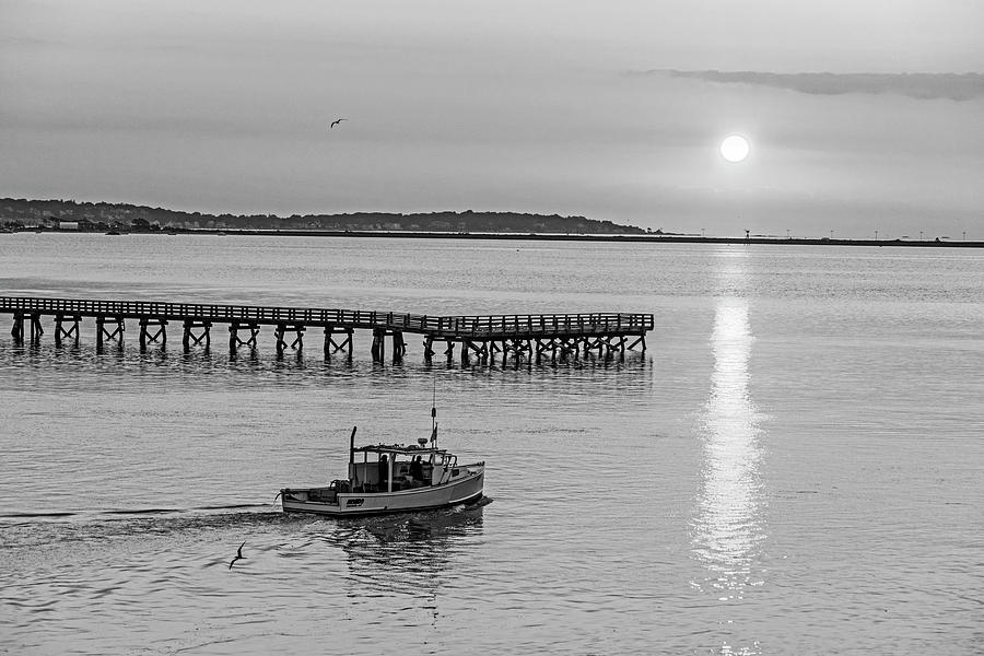 Fishing boat going by the Fishing Pier at Sunrise Lynn MA Black and White Photograph by Toby McGuire