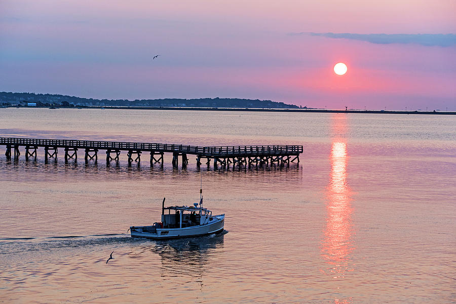 Fishing boat going by the Fishing Pier at Sunrise Lynn MA Photograph by Toby McGuire
