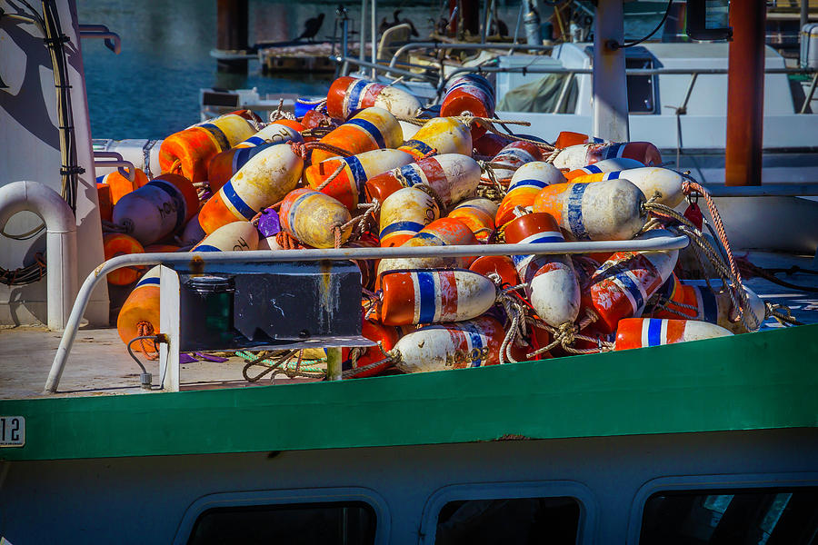 Fishing Bouys On Boat Deck Photograph by Garry Gay