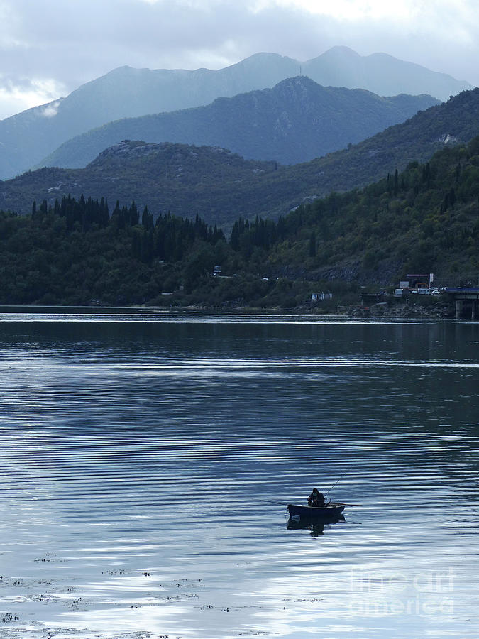 One man in his boat - Fishing on Lake Skada - Montenegro Photograph by Phil Banks