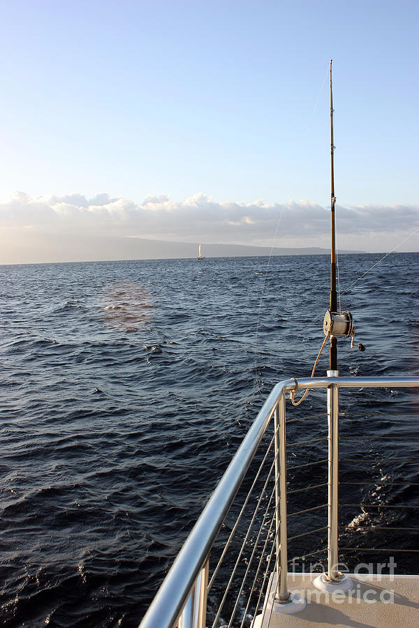 Fishing Pole at the Back of Boat cast into Pacific Ocean