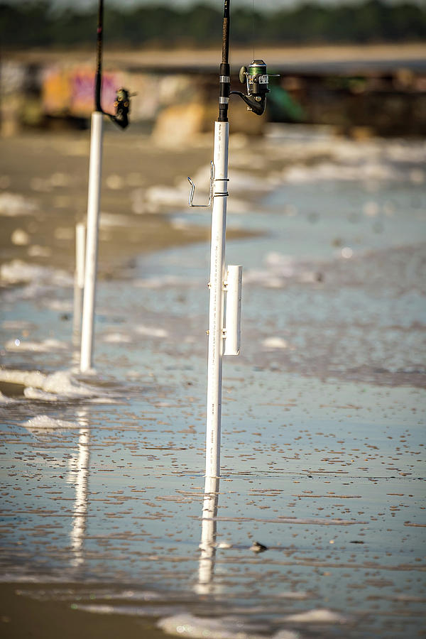 Fishing Rods Dug Into Ocean Beach Coast Photograph by Alex Grichenko