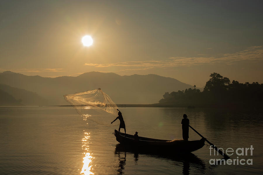 Fishing the light Photograph by Kiran Joshi