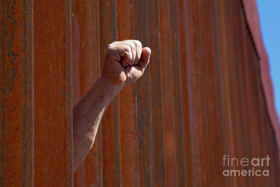 Fist Through Border Fence Photograph by Jim West