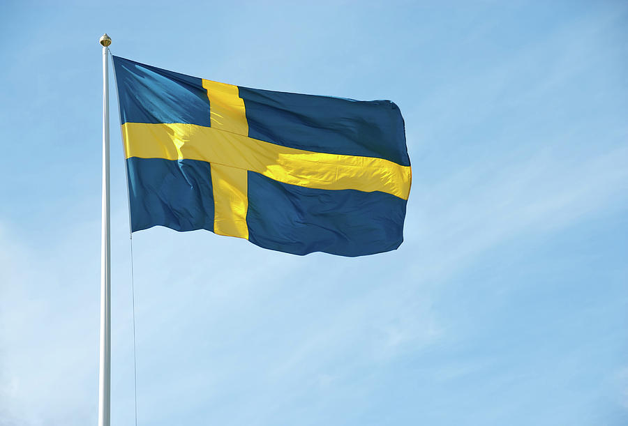 Flag Photograph - Flag of Sweden in the blue sky by GoodMood Art