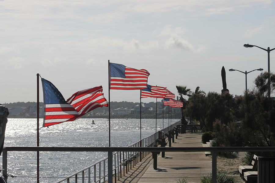 Flags On The Inlet Boardwalk Photograph by Robert Banach
