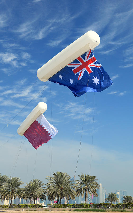 Football Photograph - Flags over Doha for the Asian Cup by Paul Cowan