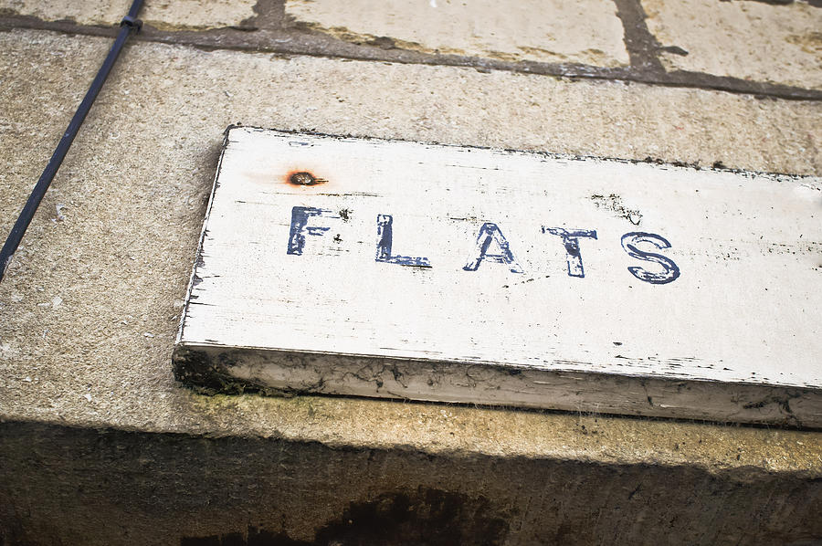 Architecture Photograph - Flats sign by Tom Gowanlock