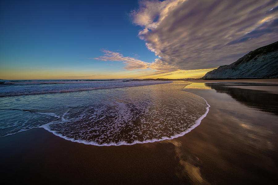 Flattening wave at Zumaia Beach, Spain Photograph by Judith Barath