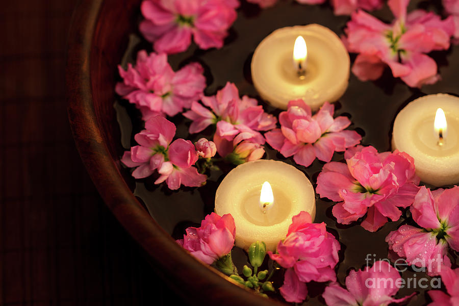 Floating Candle And Flowers Photograph