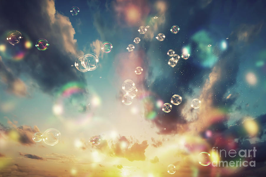Floating soap bubbles and a sunset sky Photograph by Michal Bednarek