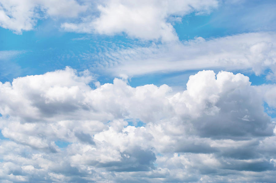 Fluffy White Clouds in Blue Sky Photograph by Jenny Rainbow