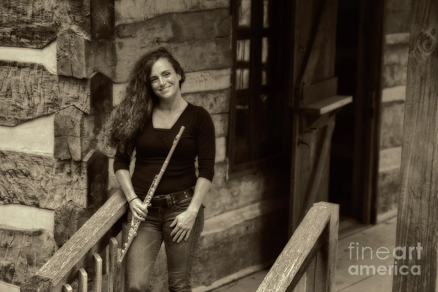 Flute player at the log home Photograph by Dan Friend