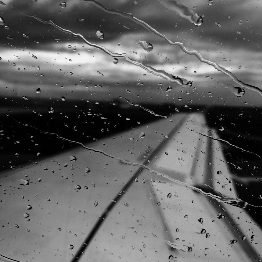 Black And White Photograph - Fly Away on a Rainy Day by Chris Feichtner
