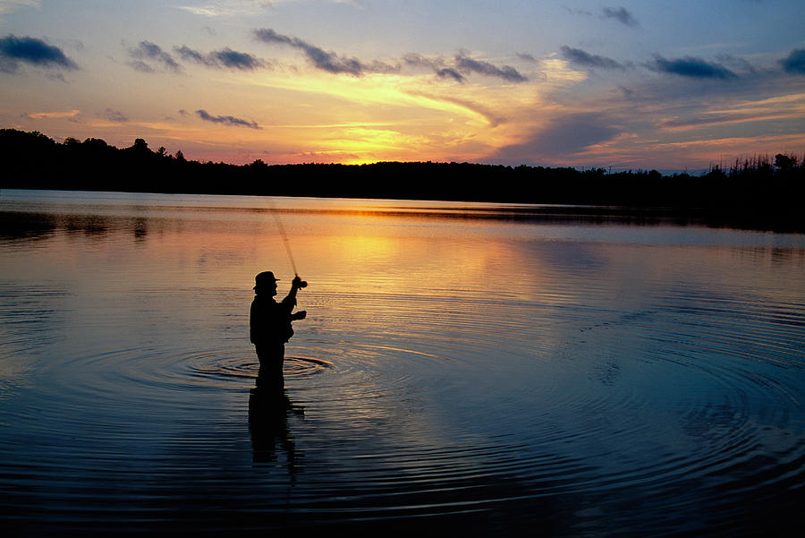 Nature Photograph - Fly-fisherman Silhouetted By Sunrise by Panoramic Images