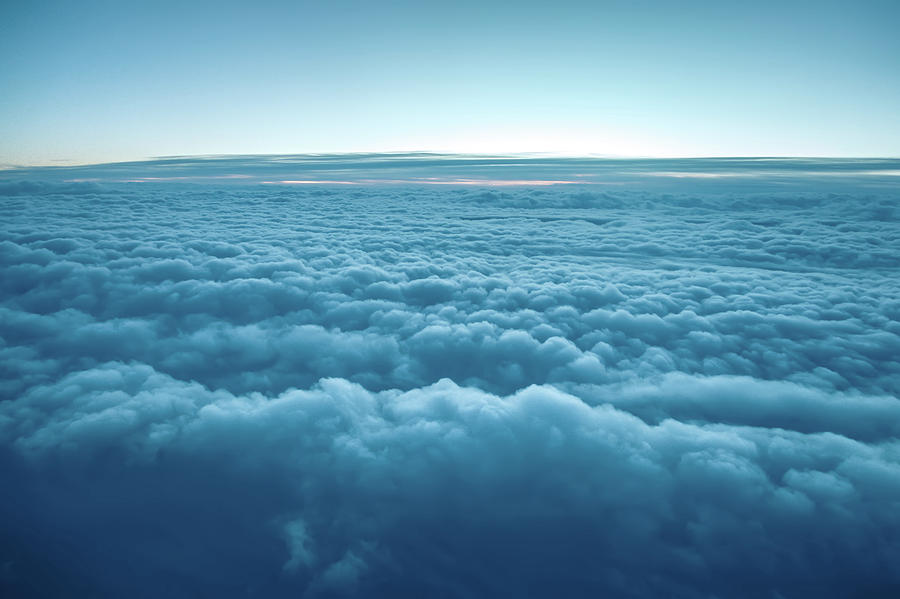 Flying above the clouds. view from the airplane Photograph by Alex Grichenko