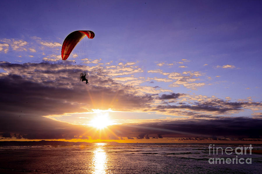 Paraglide - flying on sun rays Photograph by Kip Krause