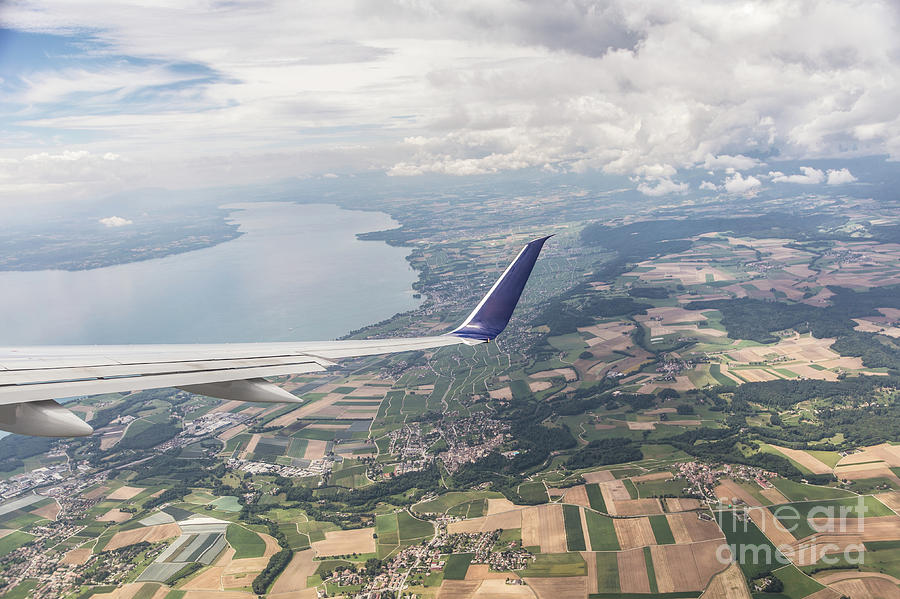 Flying over lake Geneva Photograph by Didier Marti