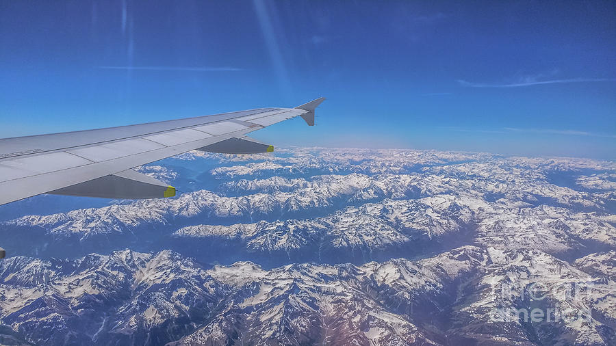 Flying over the Alps Photograph by Claudia M Photography