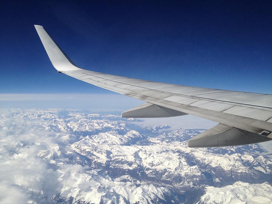 Winter Photograph - Flying over the snowy Alps by Stefano Bagnasco