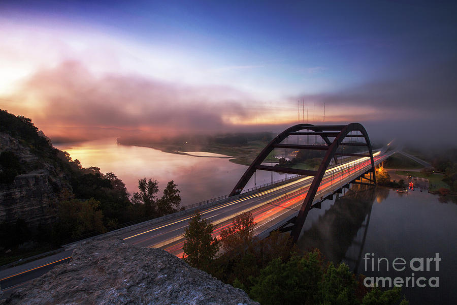 360 Bridge Photograph - Fog rolls over the 360 Bridge during sunrise on a cold winters morning on Lake Austin, Texas by Herronstock Prints