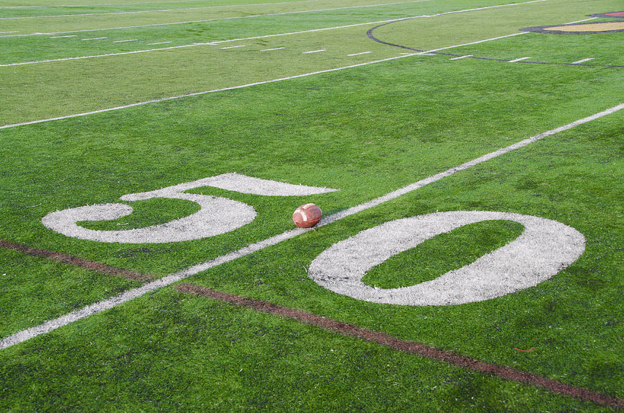 Football Photograph - Football on the 50 Yard Line by Bill Cannon