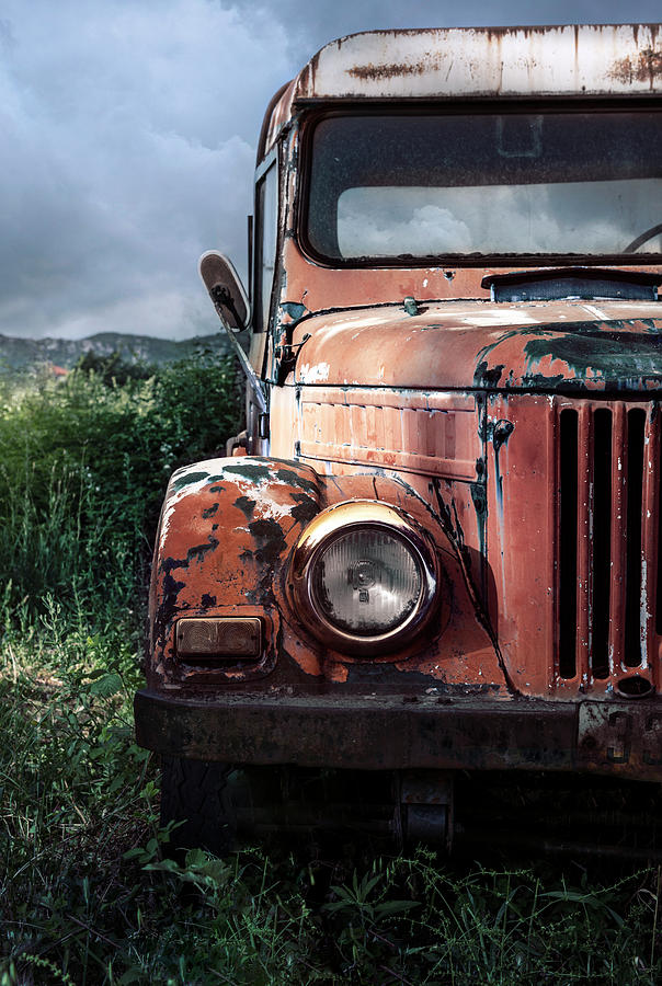 Forgotten red car Photograph by Jaroslaw Blaminsky