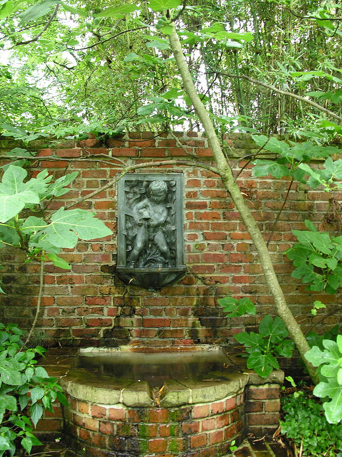 Fountain on a red brick wall Photograph by C Thomas Cooney